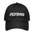 A black Under Armour Dad hat with the word 'FLYING' embroidered on the front.