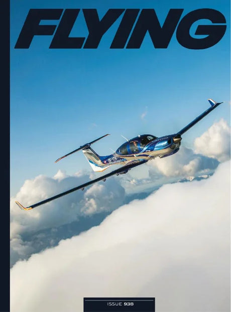 Magazine cover with a helicopter flying above clouds and 'FLYING' branding.
