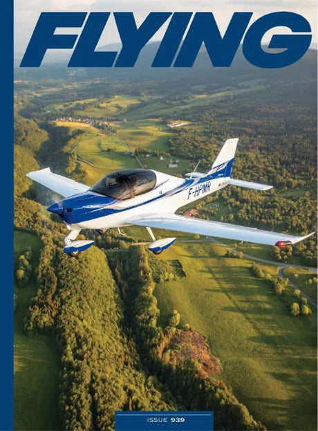 Magazine cover with an airplane flying over a landscape, featuring the word 'FLYING'.