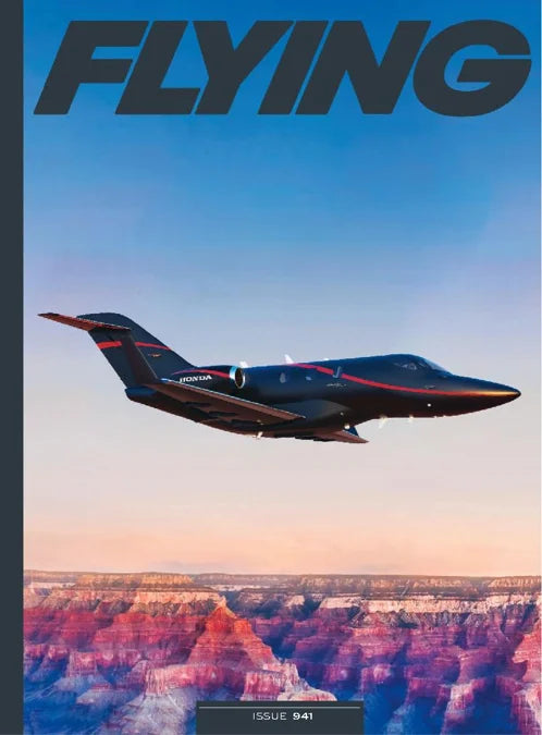 Magazine cover with a private jet flying over a canyon, titled 'Flying'.