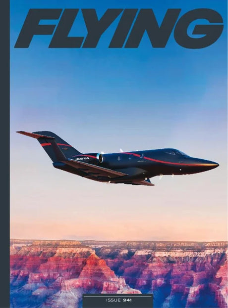 Magazine cover with a private jet flying over a canyon, titled 'Flying'.