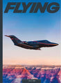 Magazine cover with a private jet flying over a canyon, titled 'Flying'.