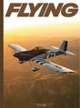 Magazine cover with an airplane flying over a mountainous landscape, featuring the word 'FLYING'.