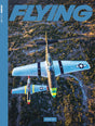 Magazine cover with a vintage airplane and 'FLYING' branding